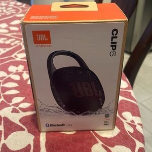 JBL Clip5, Bluetooth, v 5.3, portable speaker w/charge chord. Brand new.